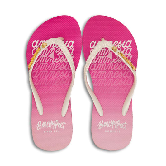 Pink and white patterned beach sandals with the brand name "Amnesia" prominently displayed on the straps.