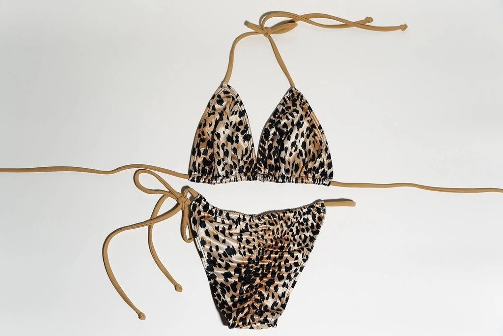 Chic leopard print bikini with gold straps and ties