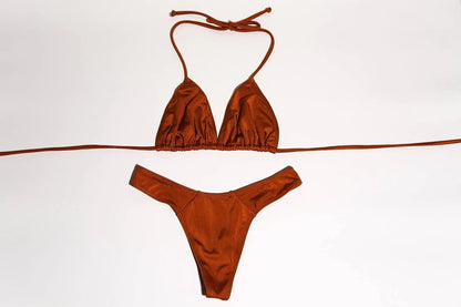 Stylish orange bikini set featuring a triangle top and cheeky bottoms displayed on a plain white background.