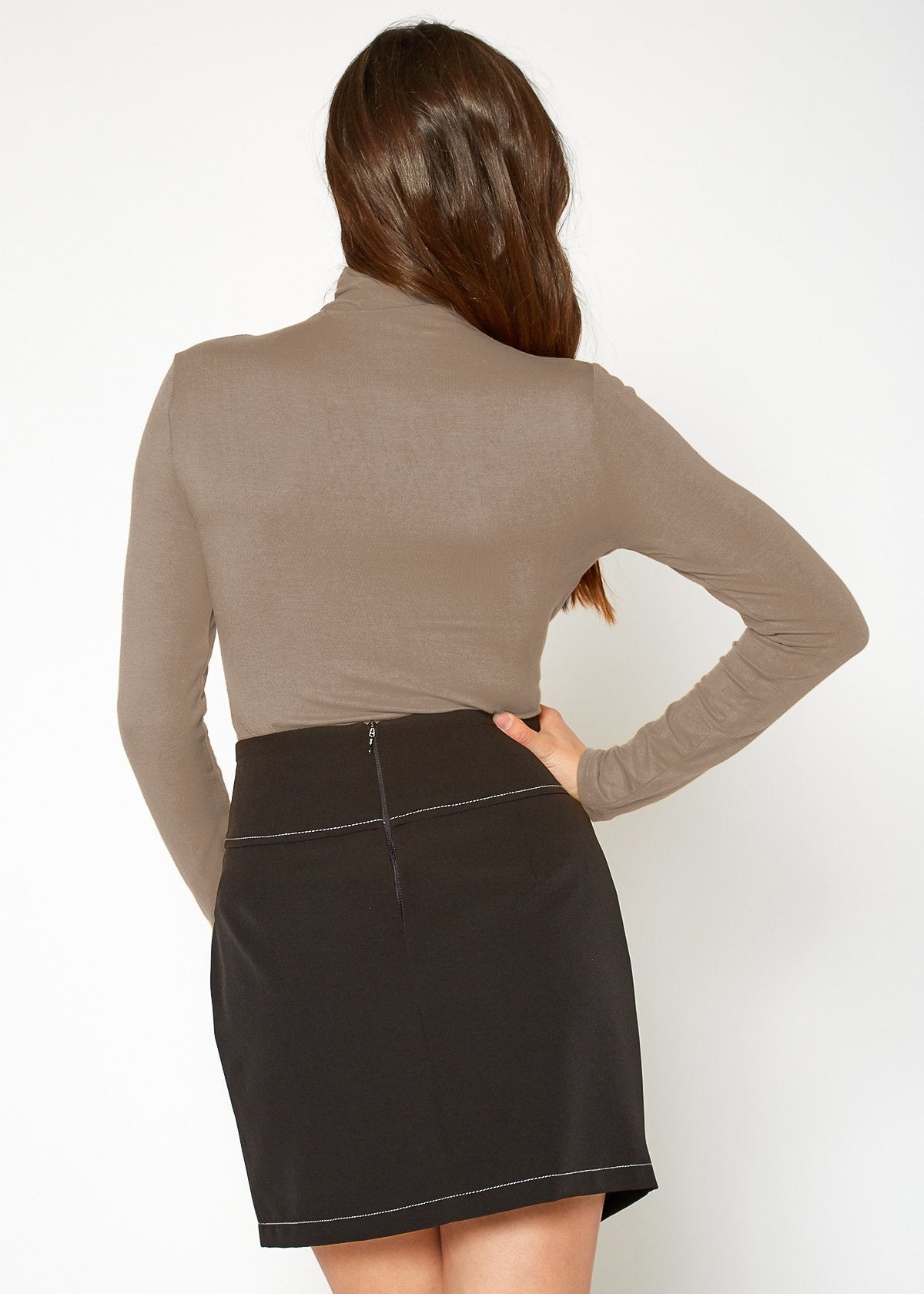 Beige long-sleeved turtleneck fitted top by Lemon Hera, worn against a plain white background.