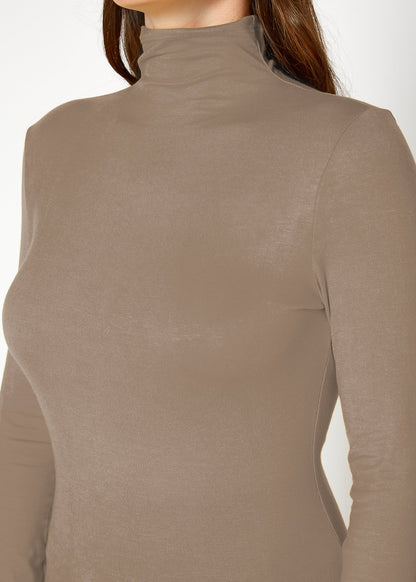 Fitted long-sleeved turtle neck top in neutral beige, showcasing a sleek, minimalist design for versatile wear.