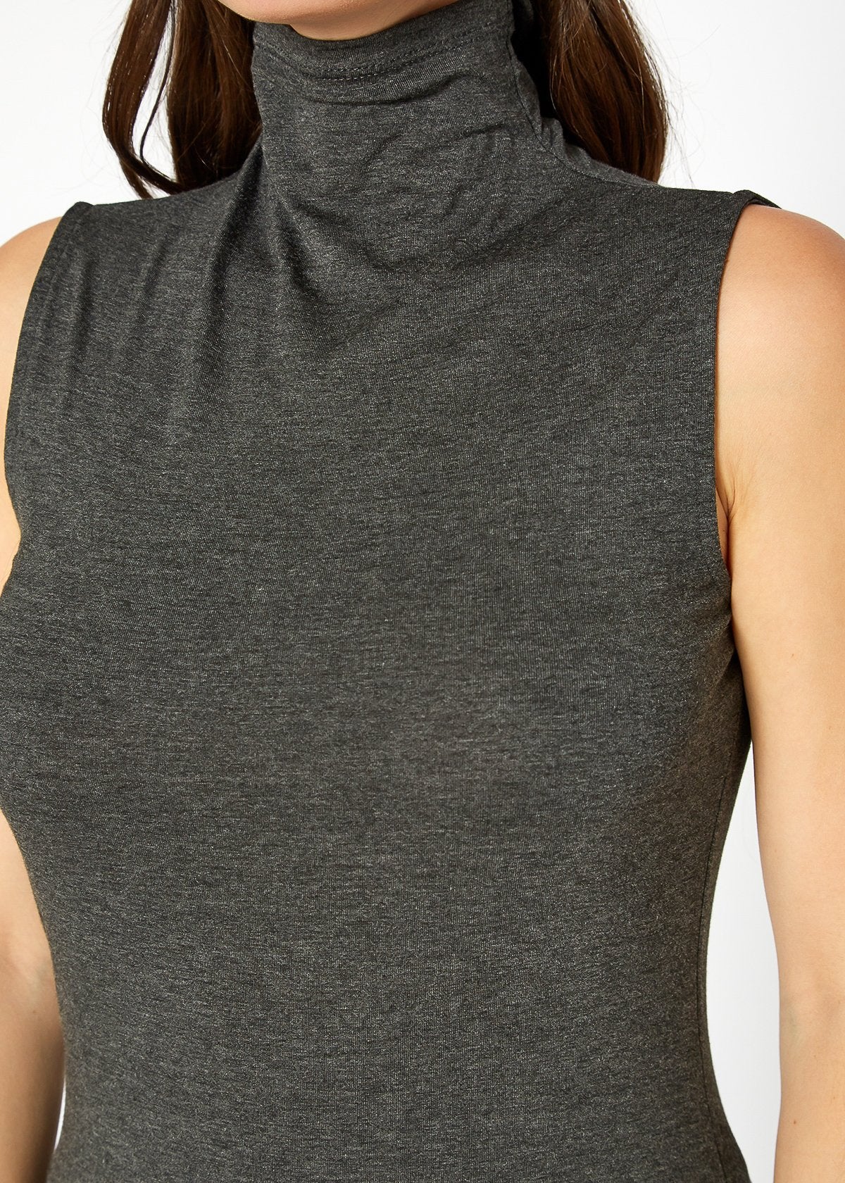 Sleek gray women's sleeveless turtleneck top with fitted silhouette for a modern, versatile look.