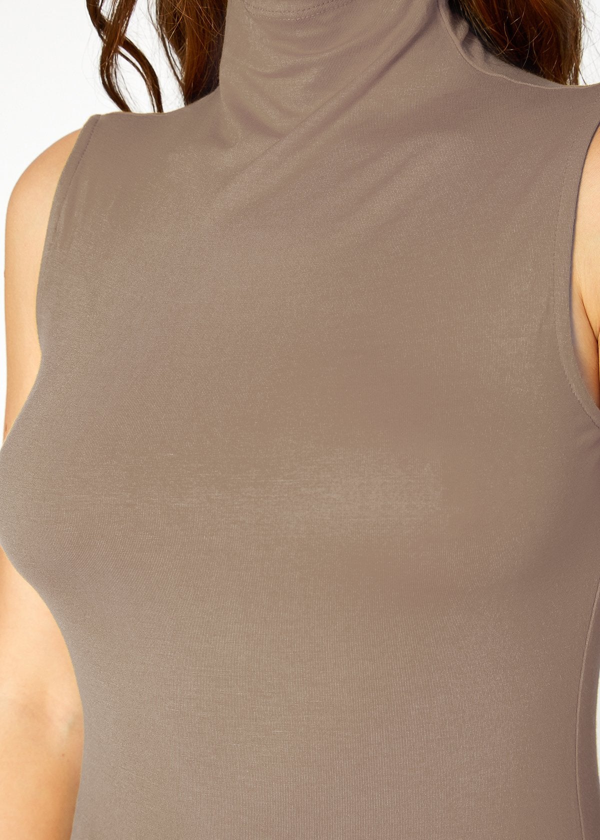 Sleek and stylish women's beige sleeveless turtle neck fitted top by Lemon Hera.