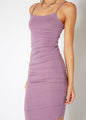 Elegant lavender maxi dress with ruched detailing and spaghetti straps, showcasing a flattering and feminine silhouette.