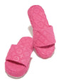 Plush pink flower slides with a quilted design, perfect for casual comfort and style.