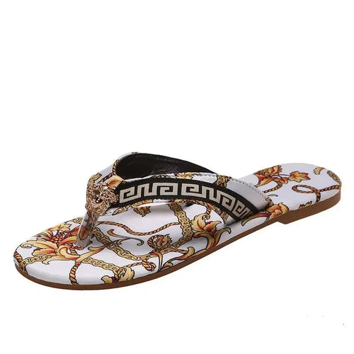 Designer style floral print slippers with ornamental chain detail