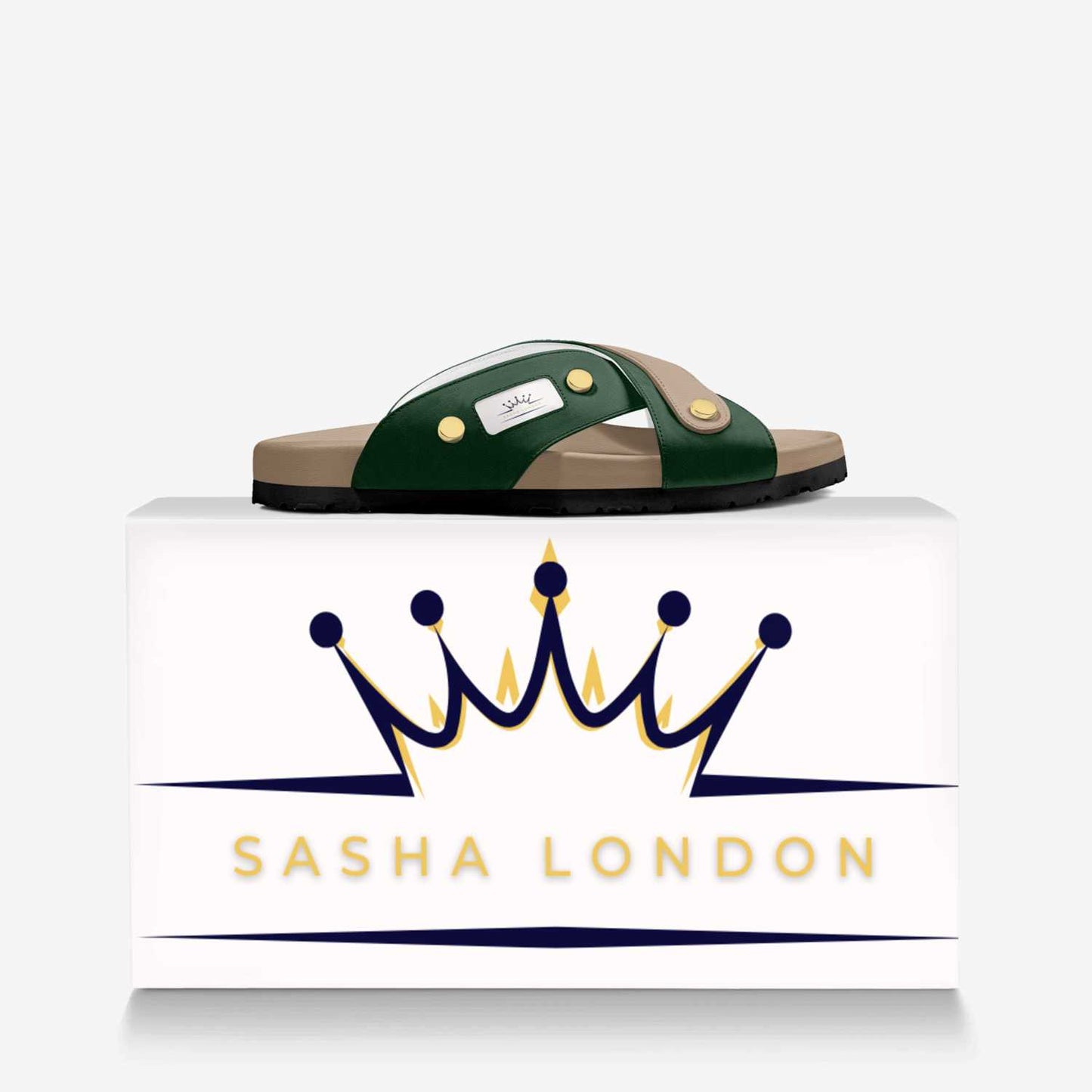 Sasha London Sandal - Stylish women's slide sandals with contrasting green straps and gold-tone metal embellishments, displayed on a minimalist white background with the Sasha London brand logo.