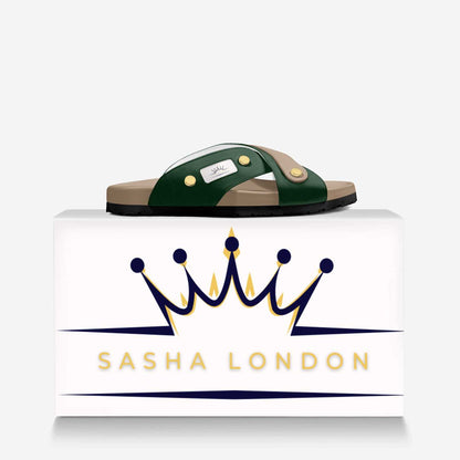 Sasha London Sandal - Stylish women's slide sandals with contrasting green straps and gold-tone metal embellishments, displayed on a minimalist white background with the Sasha London brand logo.