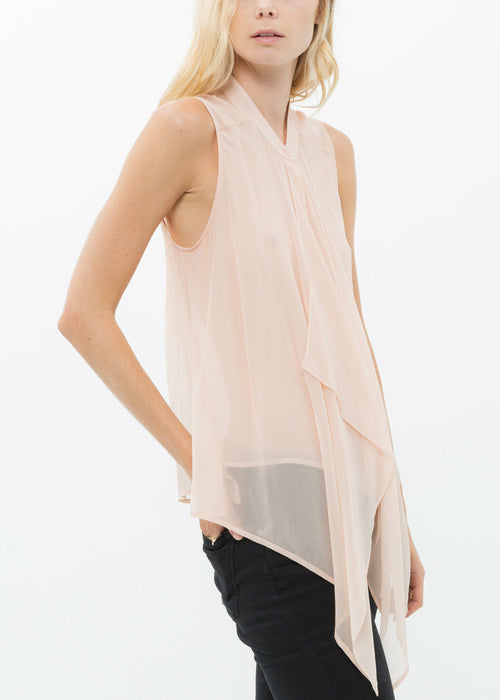 Luxurious silk drape blouse top in ethereal blush hue, showcased against a clean white background for a sophisticated, minimalist aesthetic.