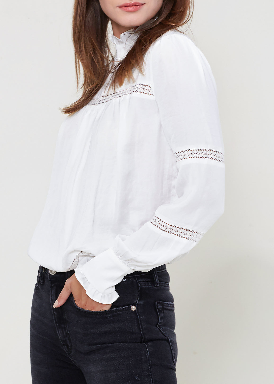 Women's Eyelet Long Sleeve Mock Neck Top in white with embroidered detail on sleeves and neckline