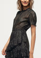 Elegant black lurex dress with ruffled details, showcased on a female model against a plain background.