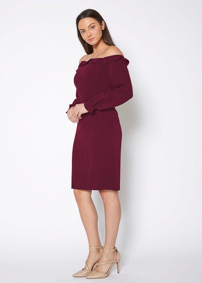 Elegant off-shoulder burgundy dress with fitted bodice, long sleeves, and a knee-length skirt, showcasing a stylish and feminine look.