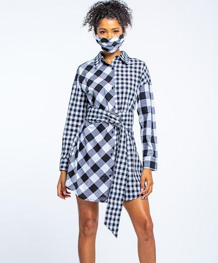 Stylish gingham shirt dress with matching face mask, featuring a collared neckline, long sleeves, and a tie waist detail, showcased on a young female model with curly hair.