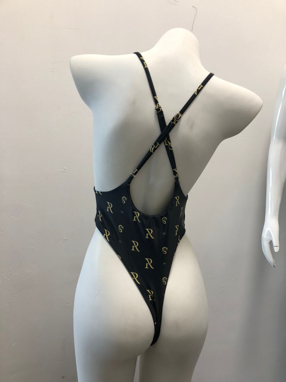 Rose Paulino Official Cross Swimsuit - Black one-piece swimsuit with allover printed cross design, adjustable straps, featuring the White Amphitryon brand logo.