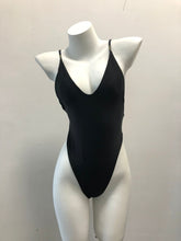 Load image into Gallery viewer, Sleek black swimsuit with a plunging neckline, showcased on a white mannequin.