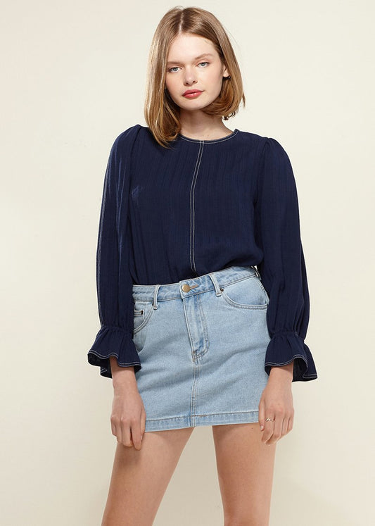 Navy women's blouse with puff shoulders and bell cuffs