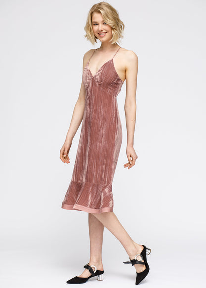 Elegant velvet midi dress with ruffle hem and spaghetti straps in a vibrant rogue color.