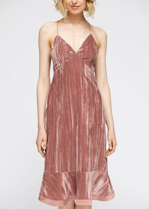 Velvet spaghetti strap dress in blush pink with ruffle hem detail, the perfect romantic midi dress for a night out.