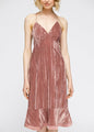 Velvet spaghetti strap dress in blush pink with ruffle hem detail, the perfect romantic midi dress for a night out.