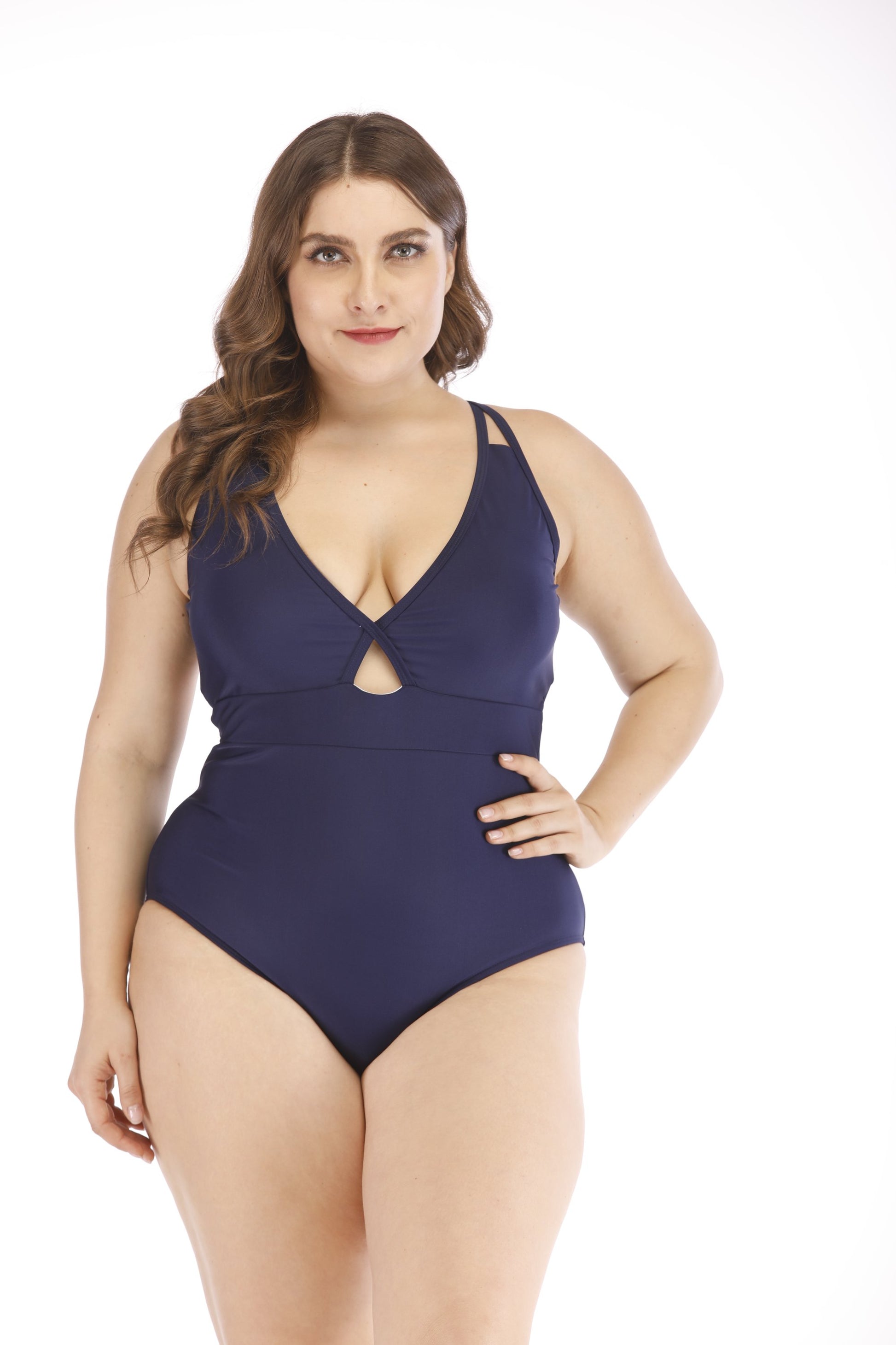 DAISY: Stylish navy blue plus-size swimsuit with plunging neckline and open cutout detail, showcasing a confident and fashionable look.