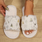 Cozy Snowflake Printed Slippers - Stylish open-toe slippers with a soft, fluffy white exterior and a whimsical snowflake print design, perfect for a cozy and chic winter look.