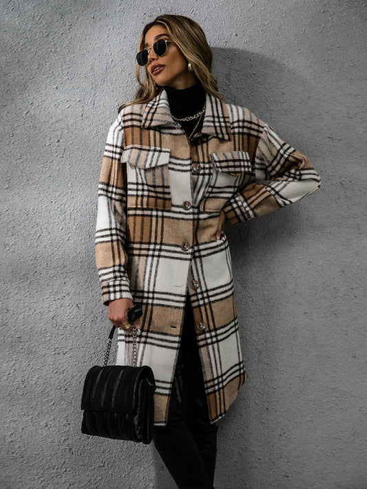 Elegant plaid collared long sleeve coat against modern gray wall