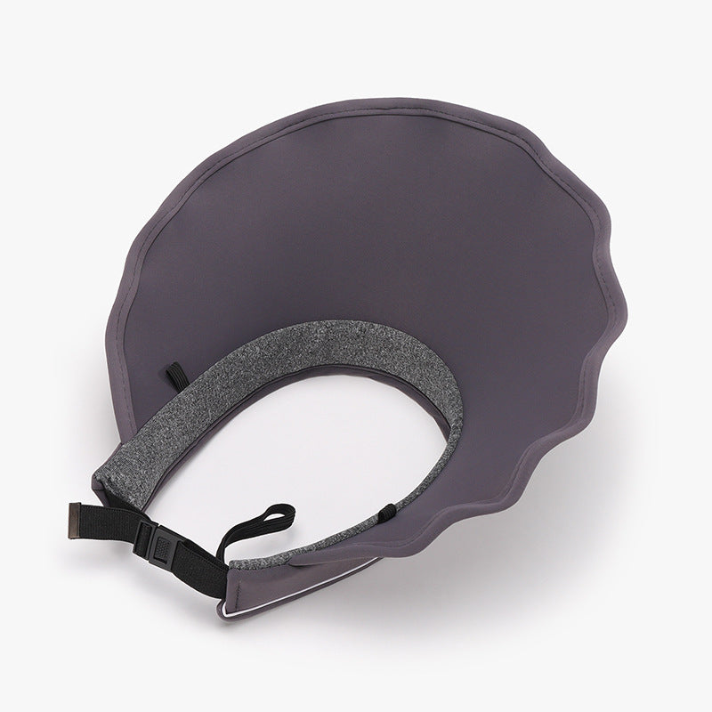 Adjustable gray sun hat with textured gray fabric and adjustable strap for a comfortable fit.