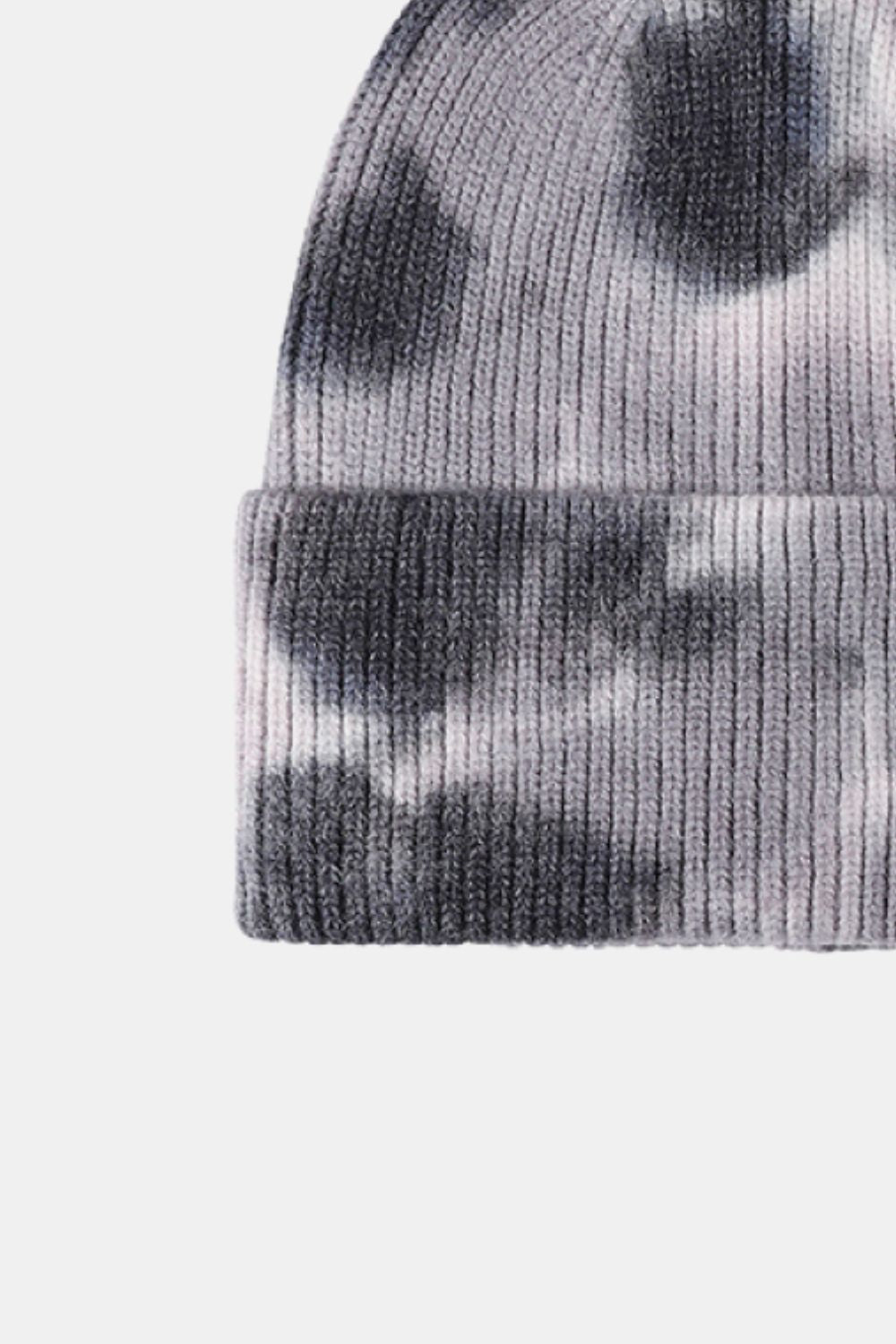 Cozy tie-dye cuffed rib-knit beanie hat featuring a stylish, mottled gray pattern.