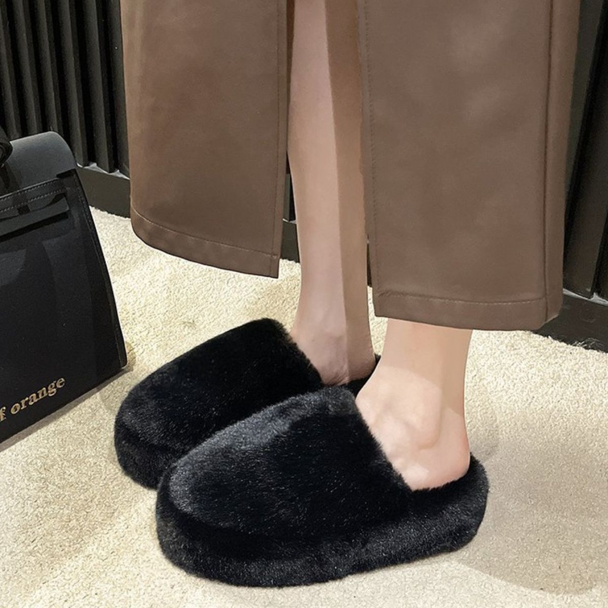 Cozy Fuzzy Black Slippers - Soft, plush furry house shoes featuring a round toe design and comfortable indoor wear for relaxation.