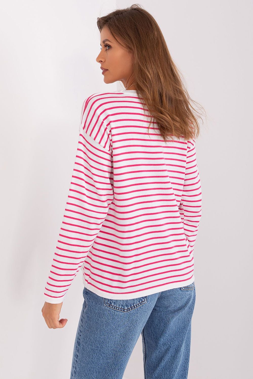 Cozy striped sweater with classic design, showcased on a young woman with long brown hair in a profile view. The sweater features a warm, comfortable fit and eye-catching red and white striped pattern, making it a versatile and stylish piece for casual everyday wear.