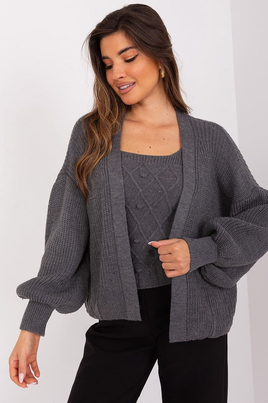 Cozy knitted cardigan and top combo on woman with long hair