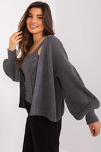 Load image into Gallery viewer, Cozy grey knit cardigan with voluminous sleeves, paired with a stylish tank top, showcasing a fashionable casual outfit on the model.