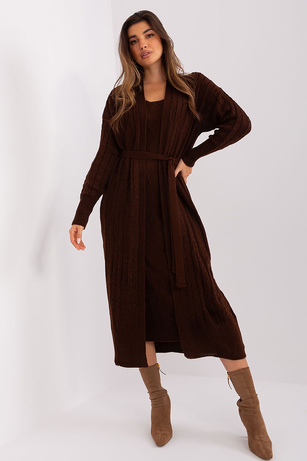 Elegant velvet midi dress by Badu featuring a long-sleeved, high-neck design and a flowing, floor-length silhouette in a rich, dark brown hue.