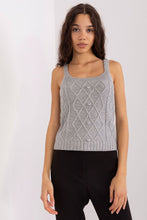 Load image into Gallery viewer, Elegant knit top with diamond pattern design, worn by a young woman with long, dark hair in a casual setting.