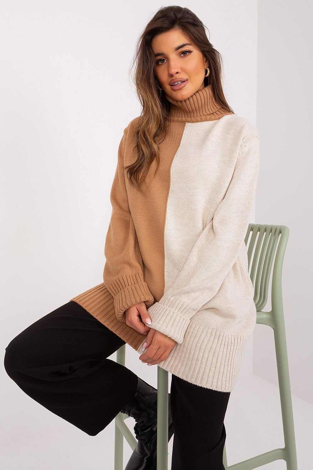 Cozy turtleneck sweater in neutral tones, featuring a female model with long brown hair posing against a white background.