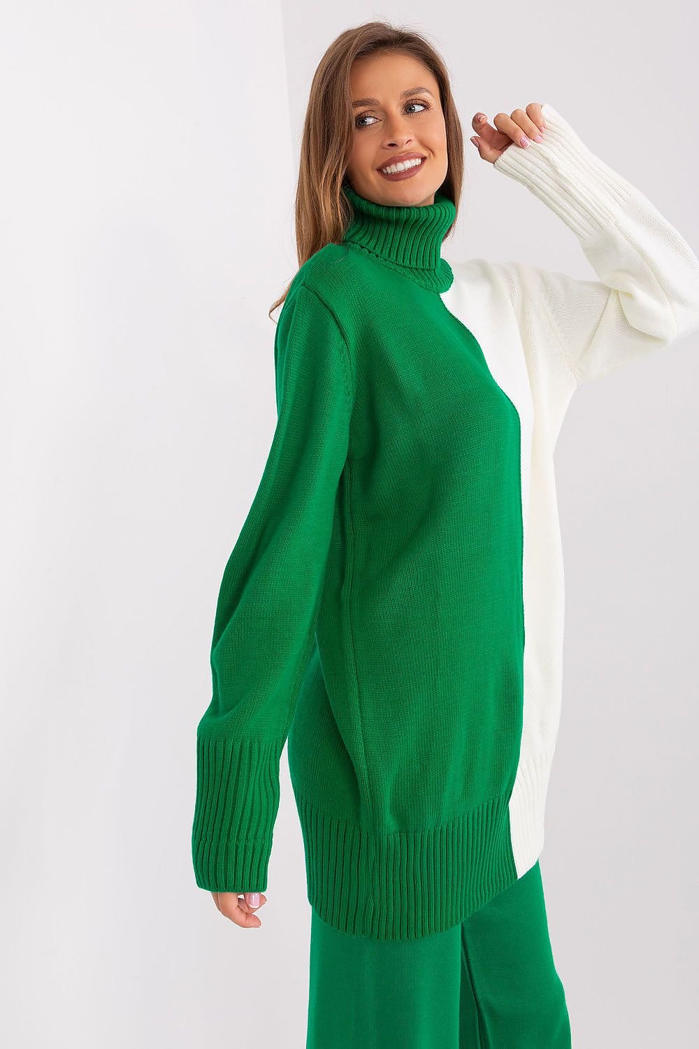 Emerald green turtleneck sweater worn by smiling woman in casual attire.