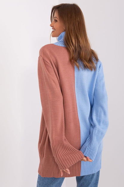 Cozy colorblock turtleneck sweater with ribbed cuffs and soft, oversized silhouette.