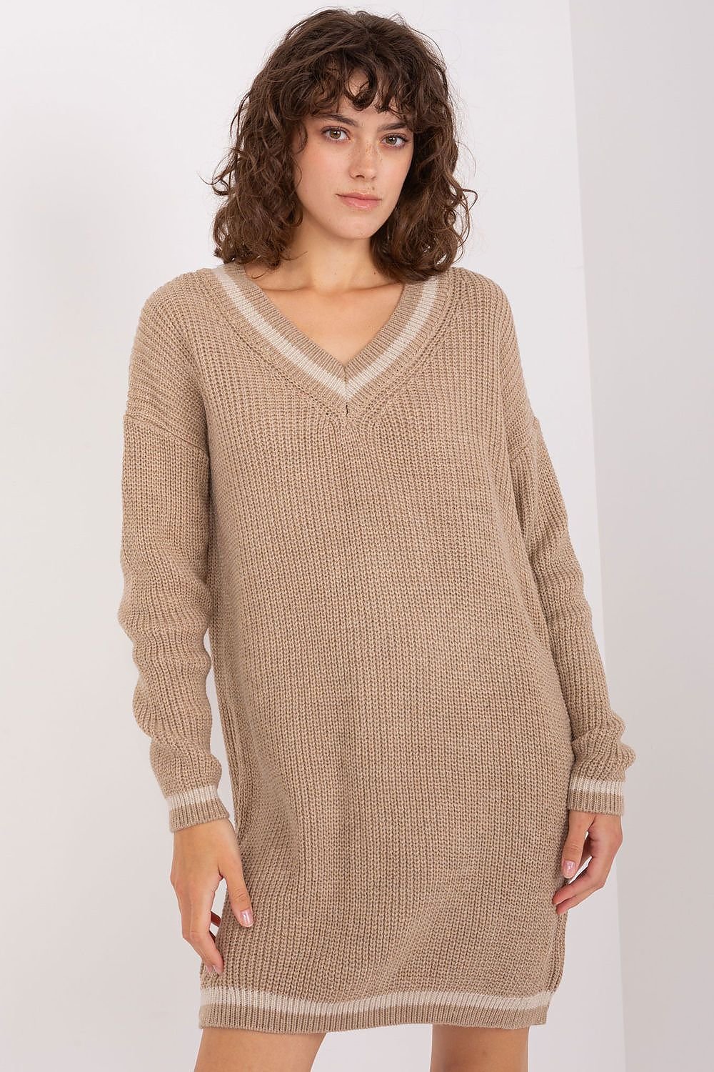 Relaxed knit V-neck dress with cozy ribbed details, ideal for casual weekends.