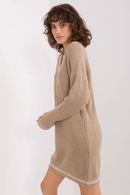 Beige knit dress with curly brown hair model