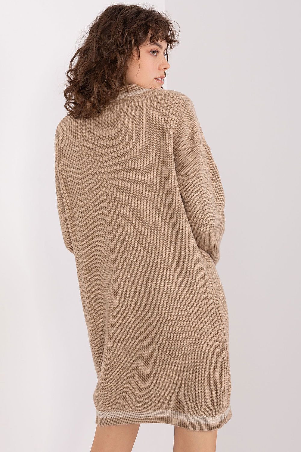 Cozy knit dress with long sleeves, featuring a tan ribbed design for a comfortable, casual look.