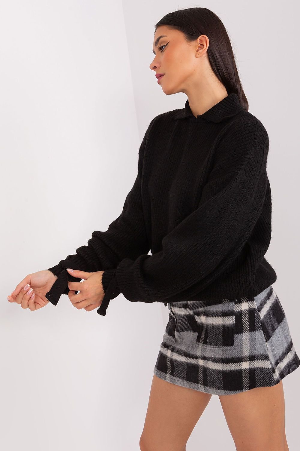 Cozy black sweater, plaid mini skirt, stylish woman's fashion