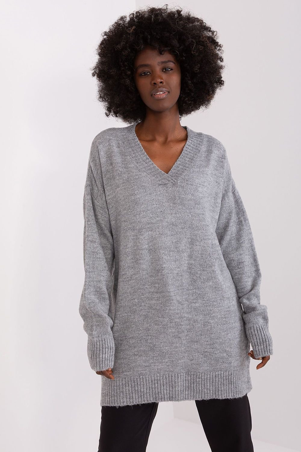 Cozy gray v-neck sweater with a stylish model featuring curly hair