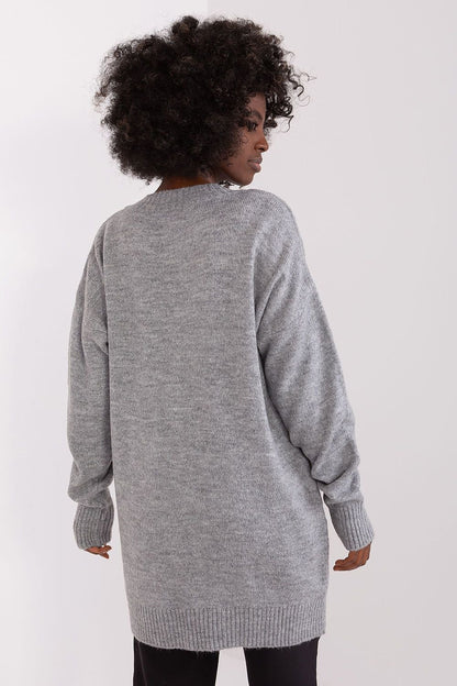 Cozy gray knitted jumper featuring a woman with curly dark hair