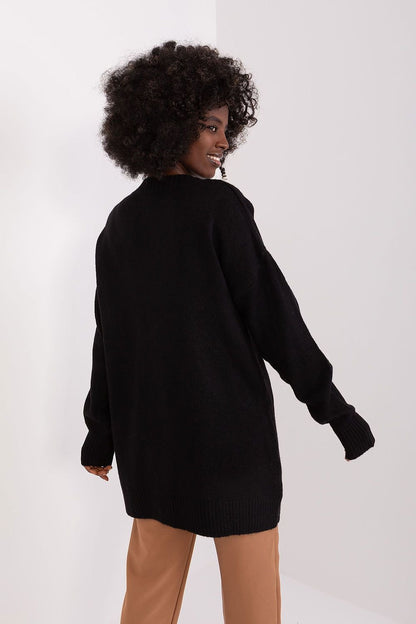 Stylish black knitted jumper for women with curly hair, featuring a unique design and comfortable fit.