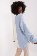 Load image into Gallery viewer, Curly-haired woman wearing a light blue ribbed knit pullover sweater