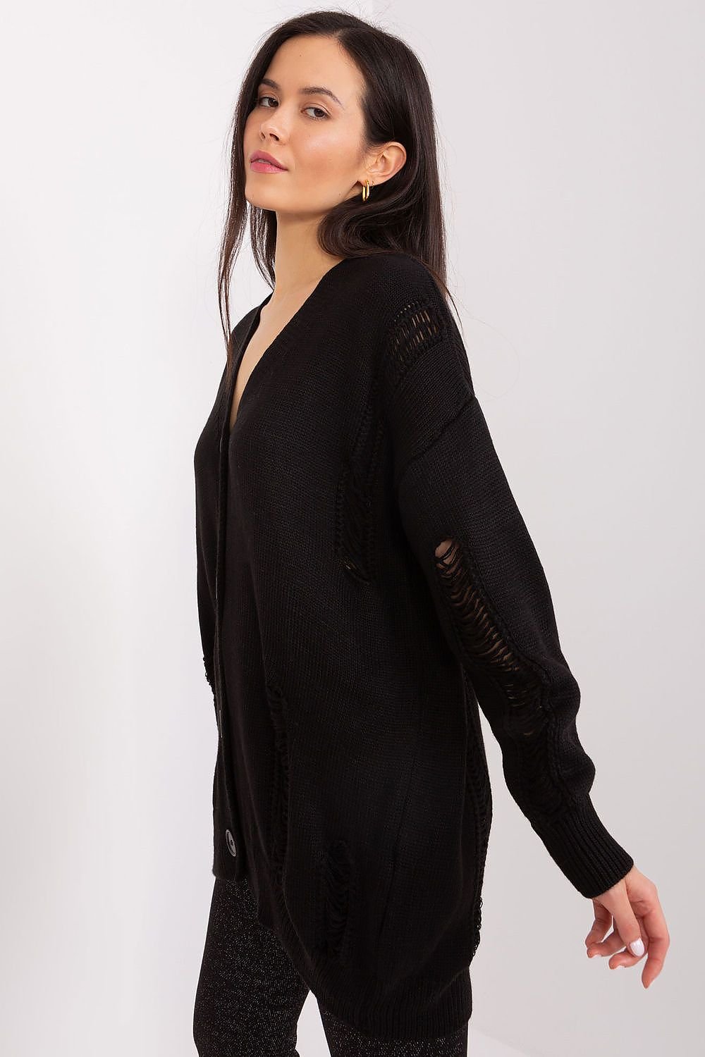 Stylish black cardigan with textured sleeves and a cozy, oversized fit.