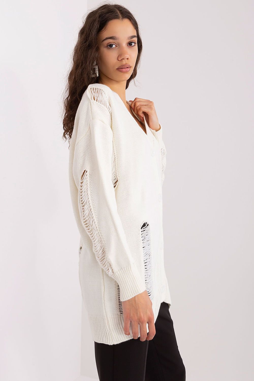 Soft, cozy knit cardigan with distressed detailing, a stylish and comfortable women's fashion piece.