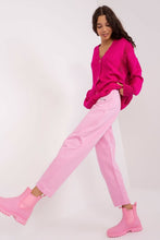 Load image into Gallery viewer, Vibrant pink cardigan and relaxed pink pants on female model