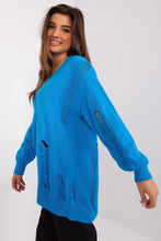 Load image into Gallery viewer, Bright blue textured knit cardigan with oversized fit and fraying detail, modeled by a smiling young woman with long brown hair.