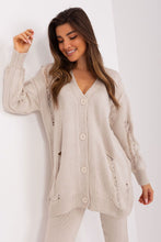 Load image into Gallery viewer, Cozy Beige Cardigan Badu
A soft, beige knit cardigan with button-down closure and a relaxed, oversized fit, allowing for a comfortable and stylish look.